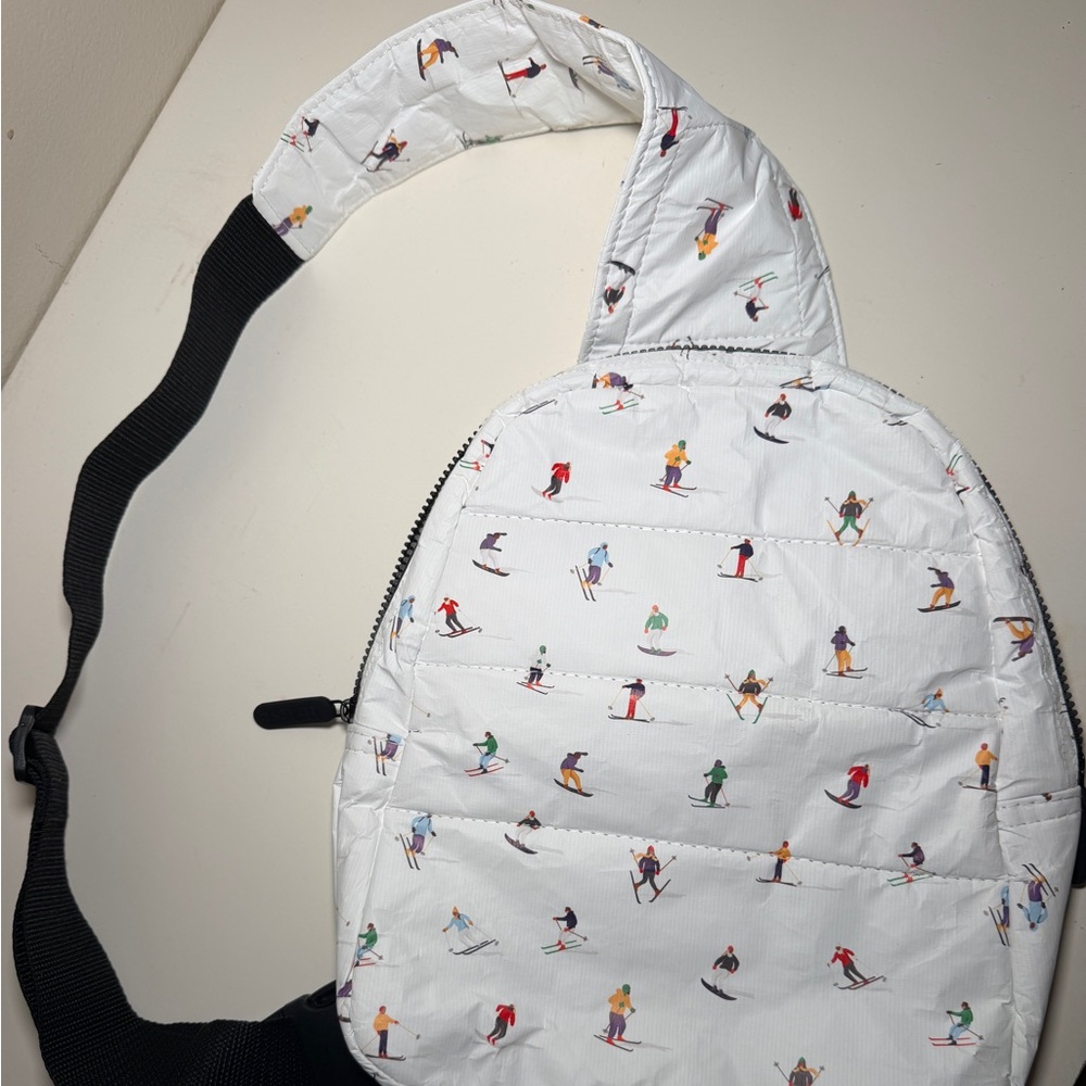 Hi, Love - Puffer Crossbody Backpack in the print  ‘Dancing Skier’